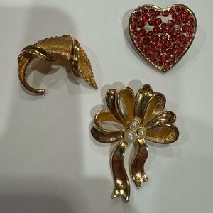 Mixed collection of Vintage 3 gold-tone brooches, Avon, Monet & costume jewelry